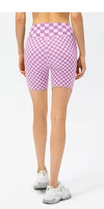 Detailed back view of purple checkerboard high waist yoga shorts with elastic fabric