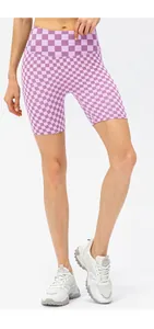 Close-up of purple checkerboard high-waisted yoga shorts with elastic fabric texture