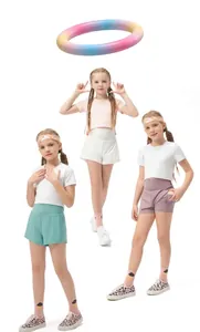 Detail view of quick-dry athletic shorts and cropped T-shirts in pastel green, white, and purple