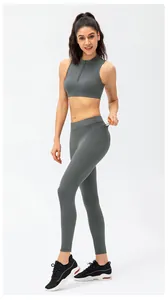 Detail of high waist yoga leggings with functional side pockets and smooth matte fabric