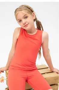 Close-up of girls' coral quick-dry yoga vest and cycling shorts set for sports training