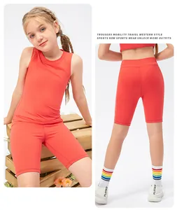 Girls red two-piece athletic set featuring racerback tank top and cycling shorts