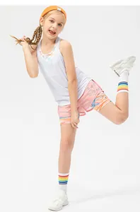 Close-up of girls' moisture-wicking sports tank top and pink shorts with print details