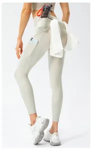 High-waisted yoga pants with functional towel loop and side pockets for running