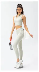 Detail of high-waist yoga pants featuring functional side pocket and towel hook