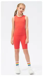 Girls orange sleeveless crop top and high-waist cycling shorts sports set for dancing