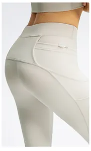 Detail view of high waist yoga pants with hidden back zipper pocket and side pockets