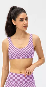 U-neck sports bra showing purple checkered pattern and moisture-wicking fabric