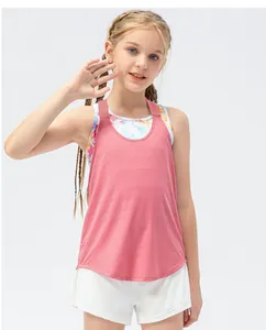 Detail of pink breathable racerback top layered over colorful tie-dye sports bra