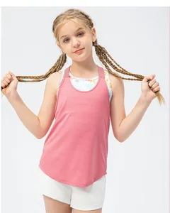 Detail of girls' breathable pink tank top layered with a colorful tie-dye sports bra