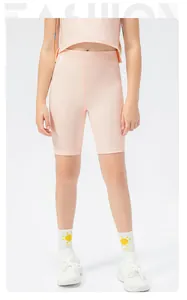 Girls pale pink two-piece sports set with slim tank top and high-waisted yoga shorts