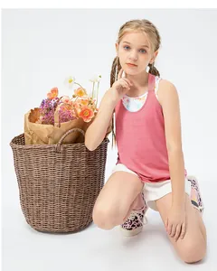 Detail view of girls pink breathable mesh sports tank top with floral inner layer