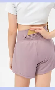 Close-up of girls' athletic shorts featuring a hidden back waistband pocket for storage
