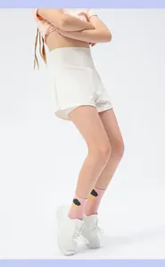 Detail of girls' white double-layer athletic shorts showing breathable mesh and liner