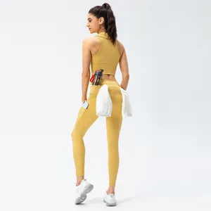 Women's mustard yellow high waist yoga leggings with side pockets and towel loop