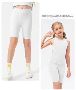 Detailed close-up of girls' high-elasticity white yoga shorts and athletic tank top set
