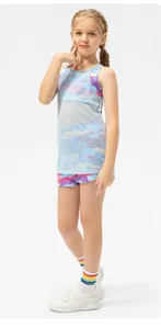 Three-piece girls activewear set with blue mesh top, tie-dye sports bra and printed shorts