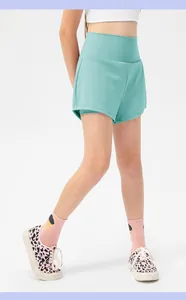 Detail of girls' mint green double-layer sports shorts with high waistband and inner liner
