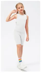 Detail of white girls' high-stretch athletic set with racerback tank and cycling shorts