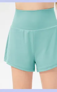 Close-up of mint green double-layer sports shorts with high wide elastic waistband