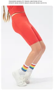 Side view of red athletic yoga set for girls with stretch shorts and tank top