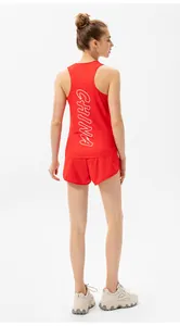 Detail of red athletic tank top featuring white CHINA print and matching shorts