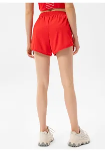 Rear view of red quick-dry athletic shorts with elastic high waist and curved hem