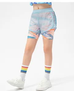 Close-up of girls' 2-in-1 sports shorts with blue mesh layer and patterned inner lining