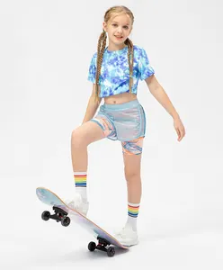 Detail of girls' layered activewear shorts with blue dye print and breathable mesh fabric