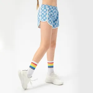 Girls checkered sports shorts in blue and white with elastic waist and side piping