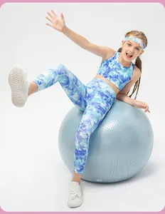 Detail of blue and white tie-dye elastic leggings and sports top on a child model