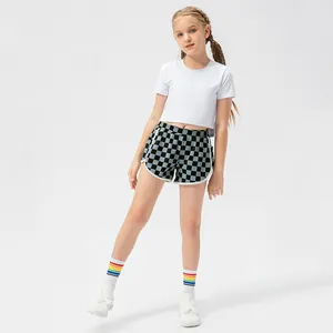 Girls checkered sports shorts with white crop top tee for running and dancing outfit