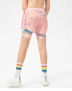 Rear view of girls' double-layer sports shorts with pink abstract print and athletic socks