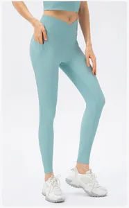 Detail of light blue yoga leggings with high-waisted V-cut crossover and side pocket