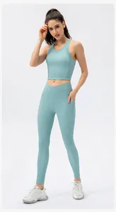 Close-up of high-waisted crossover waistband and side pocket detail on yoga pants