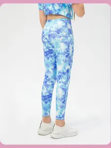 Detail of girls tie-dye blue and white elastic sports leggings and short sleeve top set