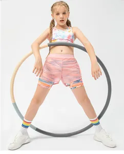 Detail of girls' tie-dye sports vest and layered mesh shorts with pink finish