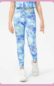 Close-up of blue and white tie-dye patterns on girls high-waisted athletic leggings