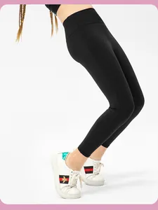 Close-up of black high-waisted girls' leggings showing stretch material and slim fit design