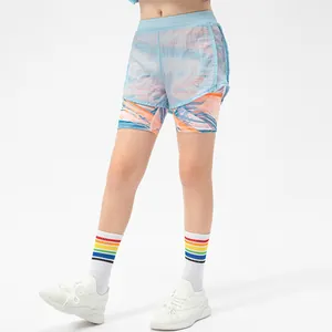 Girls' double-layer sports shorts with blue outer layer and vibrant floral inner lining