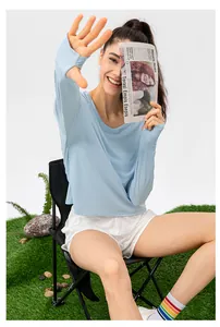 Detail of light blue sun protection shirt with thumbholes for outdoor fitness and sports