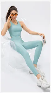 Detailed close-up of light green high-waisted yoga pants with ribbed texture and side pockets