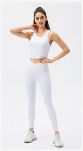 Detail view of high waist yoga pants with V-cross waistband and ribbed texture fabric