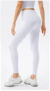Macro detail of white high-waisted ribbed yoga pants with side pockets and slimming fit