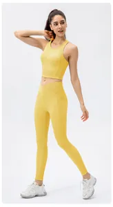 Detail view of yellow ribbed yoga set with crossover high waist and side pockets