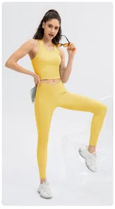 Detail of high waist yoga leggings with ribbed texture and side pocket in vibrant yellow