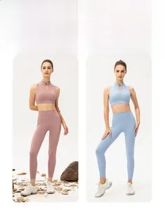Detail of high-waist yoga pants and mandarin collar sports bra in pastel blue and pink