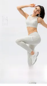 Detail showing breathable gauze splicing and sleek fabric texture on yoga sports bra