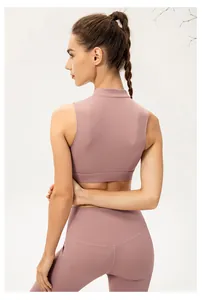Detail of racerback yoga vest and high-waist leggings with seamless stitching