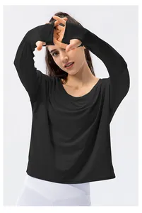 Close-up of black sun protection yoga shirt with thumb holes and breathable fabric
